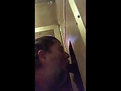 sucking black cock at the glory hole