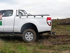 stuck pickup spinning tires offroad in mud and burnout