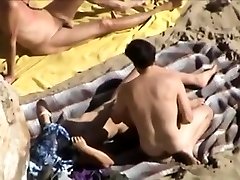 Public beach before wearing dress of a voyeur horny couple