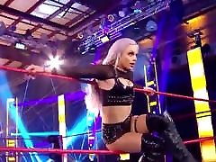 WWE - Liv Morgan posing between the ring ropes