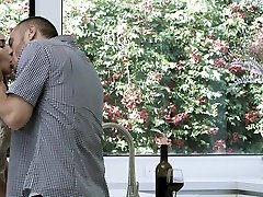 Beautiful young couple is having sex fun in the kitchen