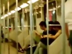 Asian lesbian couple make out in metro