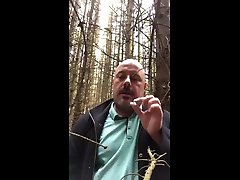 hauling a cigarette butt in the forest