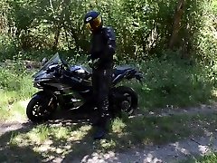piss break for the biker in forest