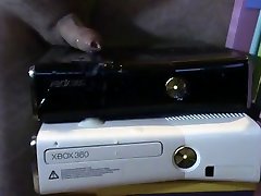 shiny black xbox 360 gets covered in cum.