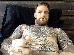tall bearded tattooed straight guy jerking off his fat cock