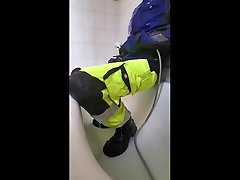 piss and mask mistery in hi viz work pants and blue mascot jacket