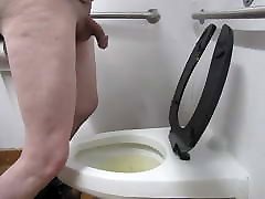 Pissing in a in nikab Bathroom