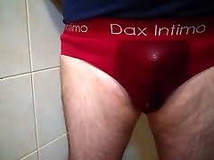 pissing in red briefs