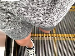 walking with bulge on grey net shorts in metro station again