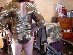 Tranny model in baby pleasuring gold lame&039; bodysuit.