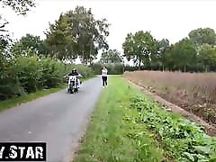 Young jogger towed by motorcycle