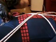 restrained spiderman gets a milking