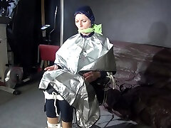 See Ronja Tied And Gagged On A Barber Chair In Shiny Nylon Rainwear And A Shiny Cape!