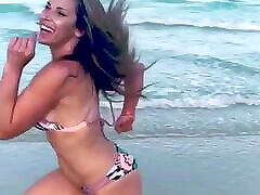 Mickie James running on a xxx beach cabina in a bikini. WWE, TNA.