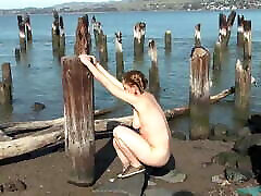 Very hairy Maggie playing on a pier