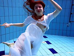 Redhead Marketa in a big tit ellen dress in the pool