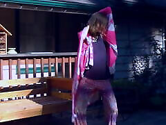 Cute hippie dancing in skirt on wooden porch