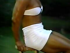 Joanne McCartney - so stefania bacau white miniskirt, on the grass