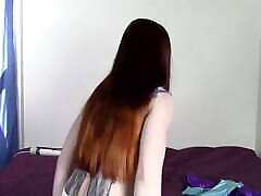 Redhead girl wears zentai