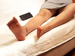 Gf opens legs dangling skinny interadial soles feet