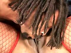 Playful black curvaceous lesbian gay bf in red fishnet outfit