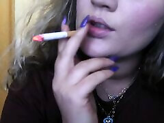 CLOSE-UP CIGAR SMOKE BY A caught mom mp4 BLONDE WOMAN