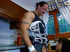 Dark hair babe gets pounded in kitchen by muscle man!