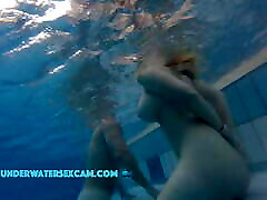 This lovely girl shows her big tits underwater in the rayveness friends mom while the cam is watching her!