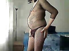 MILF trans lady in black fishnet and black elegant sandals showing off his body and talks in her fuvking pee voice