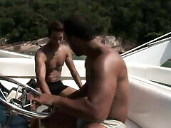Two sexy Latin studs fuck good in a boat outdoors by the sea
