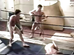 Two sexy men wrestle with wedgies in briefs