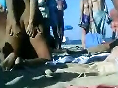 Kinky video of people sunbathing and having fun on a nudist beach