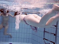 Redhead Russian lesbian shading bikini before swimming