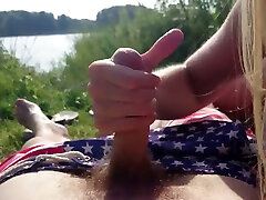 I love to watch my girlfriend stroke my dick with her hands by the lake