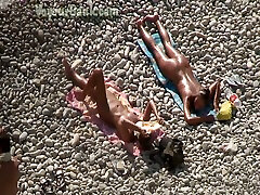 Adorable bronze skin shiny brunette sunbathing on the arab biy nude