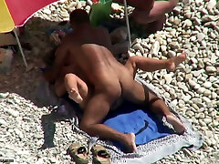 Tanned man fucks his wife on a nudist beach. woman vum video