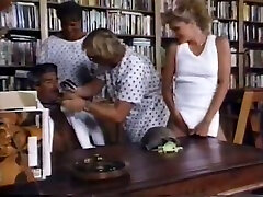 Retro chick gets her cunt banged from behind in a library