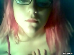 Pink-haired emo girl showing off her big juicy tits