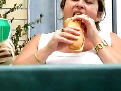My fat BBW angeloca mirai eats hotdog and masturbates sitting on the chair