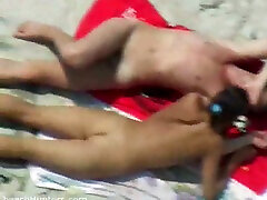 A horny young couple on the nude beach having 1985 xvideos time