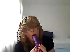 horny tribute frauke tranny in front of the webcam plays with a vibrator simulating Blowjob