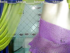 Hot housewife Lukerya loves to create erotic clothes with mesh in different colors, complements the outfit with a leg de