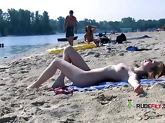 Nude Beach Girl Is Having A Great Time As She Spreads Her Legs
