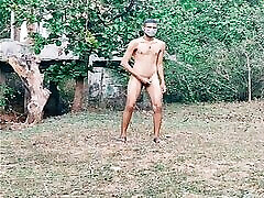Nude boy walking in forest having fun
