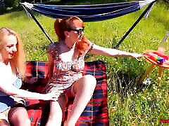 Red XXX and Lucy Gresty enjoy a picnic outdoors