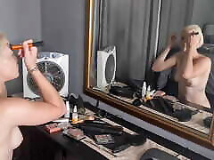 Pale small boobs bob haircut blonde doing her makeup in front of the mirror