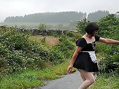 Crossdressing slut Maid on a public lane in the rain