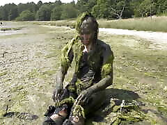 Estuary mud girl playing in boote dence nude