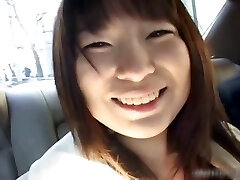 Busty asian having fun in a car